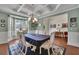Dining room featuring a decorative ceiling, natural light, and views of the front yard at 4100 Secret Shoals Way, Buford, GA 30518