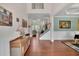 Elegant foyer featuring high ceilings, hardwood floors, a staircase, and decorative wainscoting, creating a grand entrance at 4100 Secret Shoals Way, Buford, GA 30518