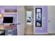 Hallway view into bedroom, showing purple walls and a desk space at 4100 Secret Shoals Way, Buford, GA 30518