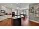 Bright kitchen features a large island, white cabinets, and stainless steel appliances at 4100 Secret Shoals Way, Buford, GA 30518