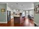 Open kitchen with a center island, stainless appliances, and a breakfast area with windows at 4100 Secret Shoals Way, Buford, GA 30518