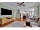 Open-concept living area with a spacious kitchen, modern finishes, and natural light at 4100 Secret Shoals Way, Buford, GA 30518
