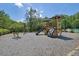 Community playground featuring a slide, climbing structure, and soft ground cover to ensure a fun safe play area at 4100 Secret Shoals Way, Buford, GA 30518