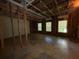 Unfinished basement showing the room's structure and window views to the yard at 4649 Camelot Dr, Douglasville, GA 30135