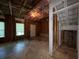 Unfinished basement shows the electrical work and structure, with natural light at 4649 Camelot Dr, Douglasville, GA 30135