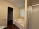 Bathroom featuring tile floors, a garden tub, and a glass shower enclosure at 4649 Camelot Dr, Douglasville, GA 30135