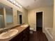Bathroom featuring tile floors, double sink vanity with granite counters, and separate tub and shower at 4649 Camelot Dr, Douglasville, GA 30135