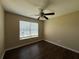 A bright bedroom features a ceiling fan and natural light streaming through the window at 4649 Camelot Dr, Douglasville, GA 30135