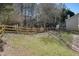 Fenced backyard with mature trees and a lush green lawn at 537 Autumn Ridge Dr, Canton, GA 30115