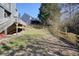 View of backyard with wooden fence and access to the home's back deck at 537 Autumn Ridge Dr, Canton, GA 30115
