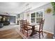 Cozy dining area with hardwood flooring, stylish rug, and a view to the living room at 537 Autumn Ridge Dr, Canton, GA 30115