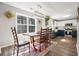 Eat-in kitchen with large window, pendant lighting, and view of the modern appliances at 537 Autumn Ridge Dr, Canton, GA 30115