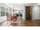 Bright dining room with hardwood floors, large window, and view into the modern kitchen at 537 Autumn Ridge Dr, Canton, GA 30115