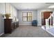 Inviting entryway with a wooden cabinet, staircase, and neutral decor at 537 Autumn Ridge Dr, Canton, GA 30115