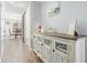 Hallway view with a view to the dining room and stylish wooden furniture at 537 Autumn Ridge Dr, Canton, GA 30115