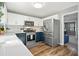 Well-appointed kitchen with stainless steel appliances, white cabinets, and bright countertop at 537 Autumn Ridge Dr, Canton, GA 30115