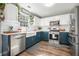 Modern kitchen featuring white subway tile backsplash, farmhouse sink, and stainless steel appliances at 537 Autumn Ridge Dr, Canton, GA 30115