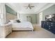 Spacious main bedroom featuring a tray ceiling, neutral walls, and plush carpeting at 537 Autumn Ridge Dr, Canton, GA 30115