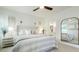 This bedroom boasts an ensuite bath and large mirror, reflecting the bed at 1846 Butterfly Way, Marietta, GA 30066