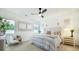 Bright bedroom features neutral decor, large windows, and a stylish ceiling fan at 1846 Butterfly Way, Marietta, GA 30066