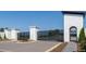 View of the gated entrance to the community with stone pillars and landscaping at 1846 Butterfly Way, Marietta, GA 30066