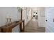 Stylish hallway with decorative wall trim, wood floors, and console table at 1846 Butterfly Way, Marietta, GA 30066