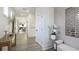 Bright hallway with wood floors, white trim, with console table and decorative mirror at 1846 Butterfly Way, Marietta, GA 30066