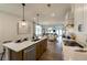 Bright open kitchen overlooking the dining and living spaces, perfect for entertaining at 1846 Butterfly Way, Marietta, GA 30066