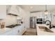 Close up of modern kitchen with white cabinets, stainless steel appliances, and sleek countertops at 1846 Butterfly Way, Marietta, GA 30066