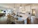 Open-concept kitchen featuring a center island with seating and modern pendant lighting at 1846 Butterfly Way, Marietta, GA 30066