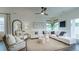 Bright living room featuring stylish furniture, jute rug, and view to the fenced yard at 1846 Butterfly Way, Marietta, GA 30066