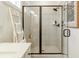 Modern glass shower with black trim, white tile, and a built-in shelf at 1846 Butterfly Way, Marietta, GA 30066