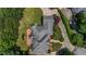 Overhead view of the property showcasing its architectural design, roof, landscaping, and circular driveway at 3018 Saint Andrews Ct, Jonesboro, GA 30236