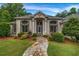 Charming home featuring a stone walkway leading to a beautiful front door and large windows at 3018 Saint Andrews Ct, Jonesboro, GA 30236