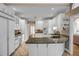 Well-appointed kitchen with white cabinetry, granite countertops, and modern appliances at 3018 Saint Andrews Ct, Jonesboro, GA 30236