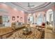 Open-concept living room with hardwood floors, elegant furnishings, and views to dining at 3018 Saint Andrews Ct, Jonesboro, GA 30236