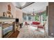 Bright living room features large windows, tile floors, a decorative fireplace and beautiful chandelier at 3018 Saint Andrews Ct, Jonesboro, GA 30236