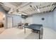 Large finished basement features a ping pong table and foosball table for recreation at 507 Falls Way, Woodstock, GA 30188