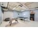 Finished basement with ping pong table, foosball, and vintage arcade machine; perfect entertainment space at 507 Falls Way, Woodstock, GA 30188
