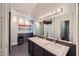 Elegant bathroom with double vanity, granite countertops, large mirror, and modern fixtures at 507 Falls Way, Woodstock, GA 30188