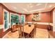Formal dining room with large window, tray ceiling and space to host gatherings at 507 Falls Way, Woodstock, GA 30188
