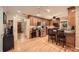Spacious kitchen with stainless steel appliances, wood cabinets, granite counters, and hardwood floors at 507 Falls Way, Woodstock, GA 30188
