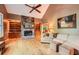 Spacious living room with hardwood floors, stone fireplace, vaulted ceilings, and built-in shelves at 507 Falls Way, Woodstock, GA 30188