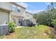 Backyard showing lawn, back of home and privacy fence at 7244 Rockhouse Rd, Austell, GA 30168