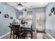Dining room showcases a modern light fixture, sleek dining table, and contemporary decor at 7244 Rockhouse Rd, Austell, GA 30168