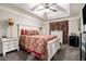 Comfortable bedroom featuring a tray ceiling, stylish décor, and soft carpet at 7244 Rockhouse Rd, Austell, GA 30168