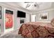 Spacious bedroom with a mounted television and a view to the ensuite bathroom and walk-in closet at 7244 Rockhouse Rd, Austell, GA 30168