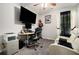 Bright home office space with desk, comfortable chairs, and ample natural light at 7244 Rockhouse Rd, Austell, GA 30168