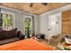 Bedroom featuring hardwood floors, ample natural light, and wooden ceiling at 1027 Spring Mill Sw Dr, Lilburn, GA 30047