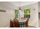 Cozy breakfast nook with bright windows and a view of the trees outside at 1027 Spring Mill Sw Dr, Lilburn, GA 30047